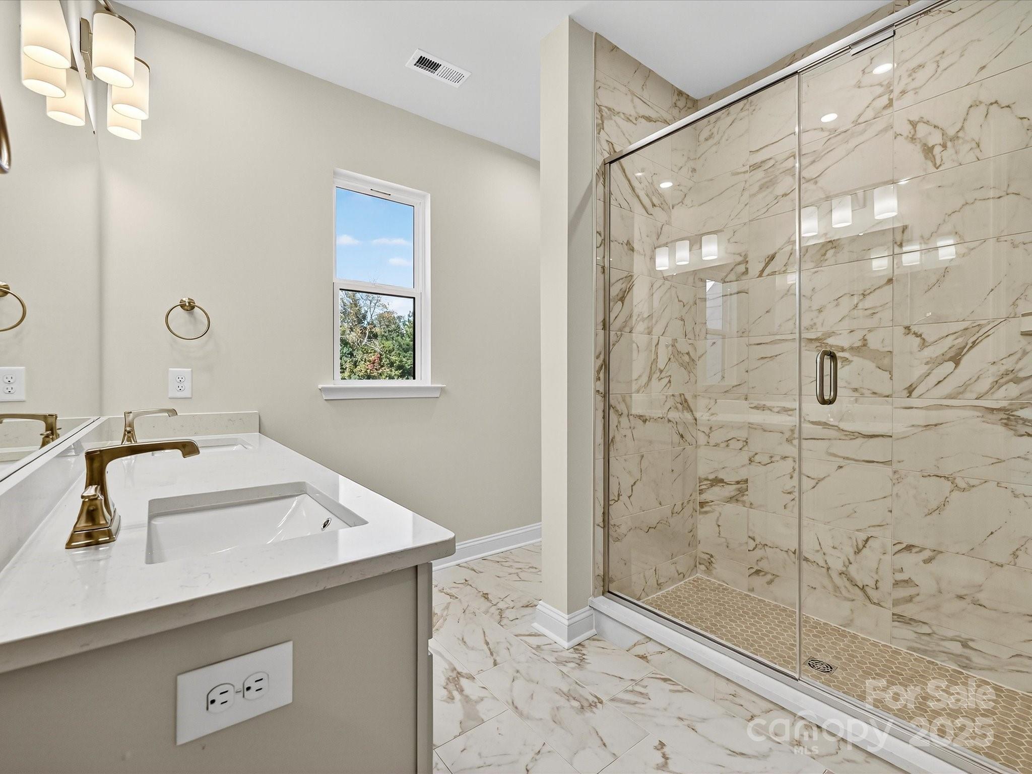 489 Nash Street Fort Mill, SC 29715 - Photo 13 of 24 a bathroom with a sink and a shower