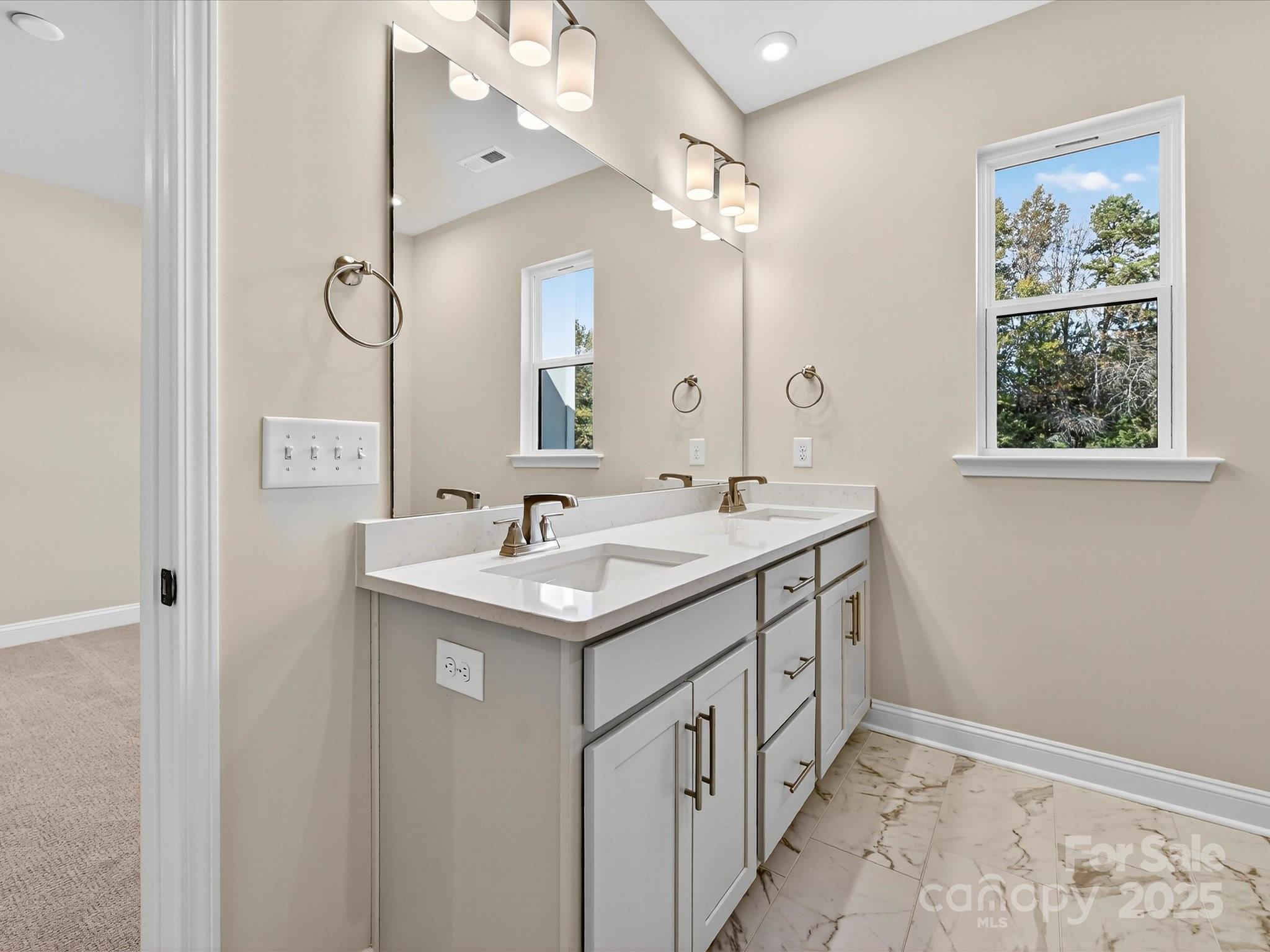 489 Nash Street Fort Mill, SC 29715 - Photo 14 of 24 a bathroom with a sink and a mirror