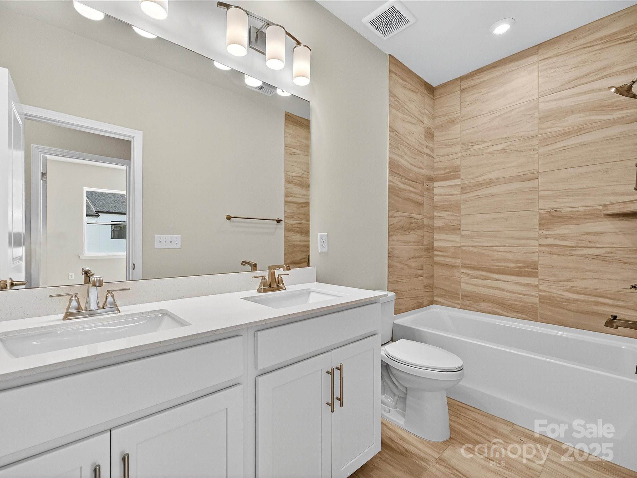 489 Nash Street Fort Mill, SC 29715 - Photo 17 of 24 a bathroom with a sink a toilet and shower