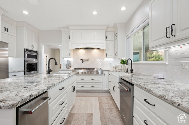 230 Boulder Way Leeds, UT 84746 - Photo 9 of 72 Main Gourmet Kitchen with white soft-close cabinets, recessed lighting, appliances with stainless steel finishes, granite stone countertops, and decorative tile backsplash