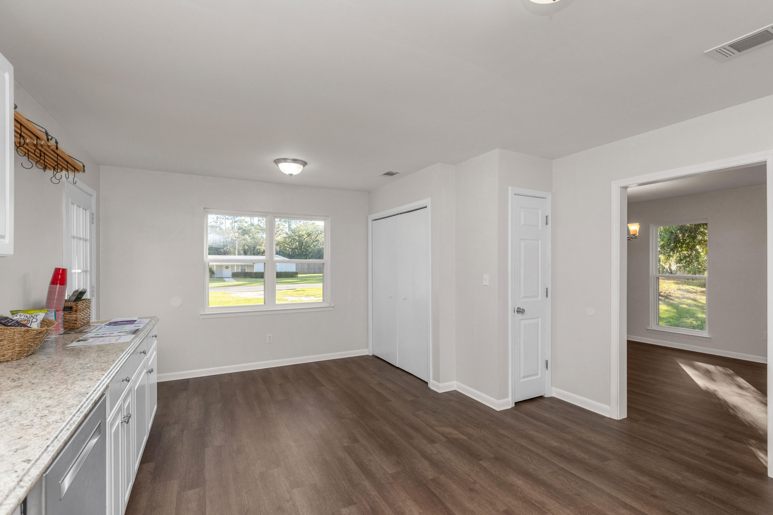 229 Madison Street Freeport, FL 32439 - Photo 16 of 44 a view of a kitchen cabinets a sink and wooden floor