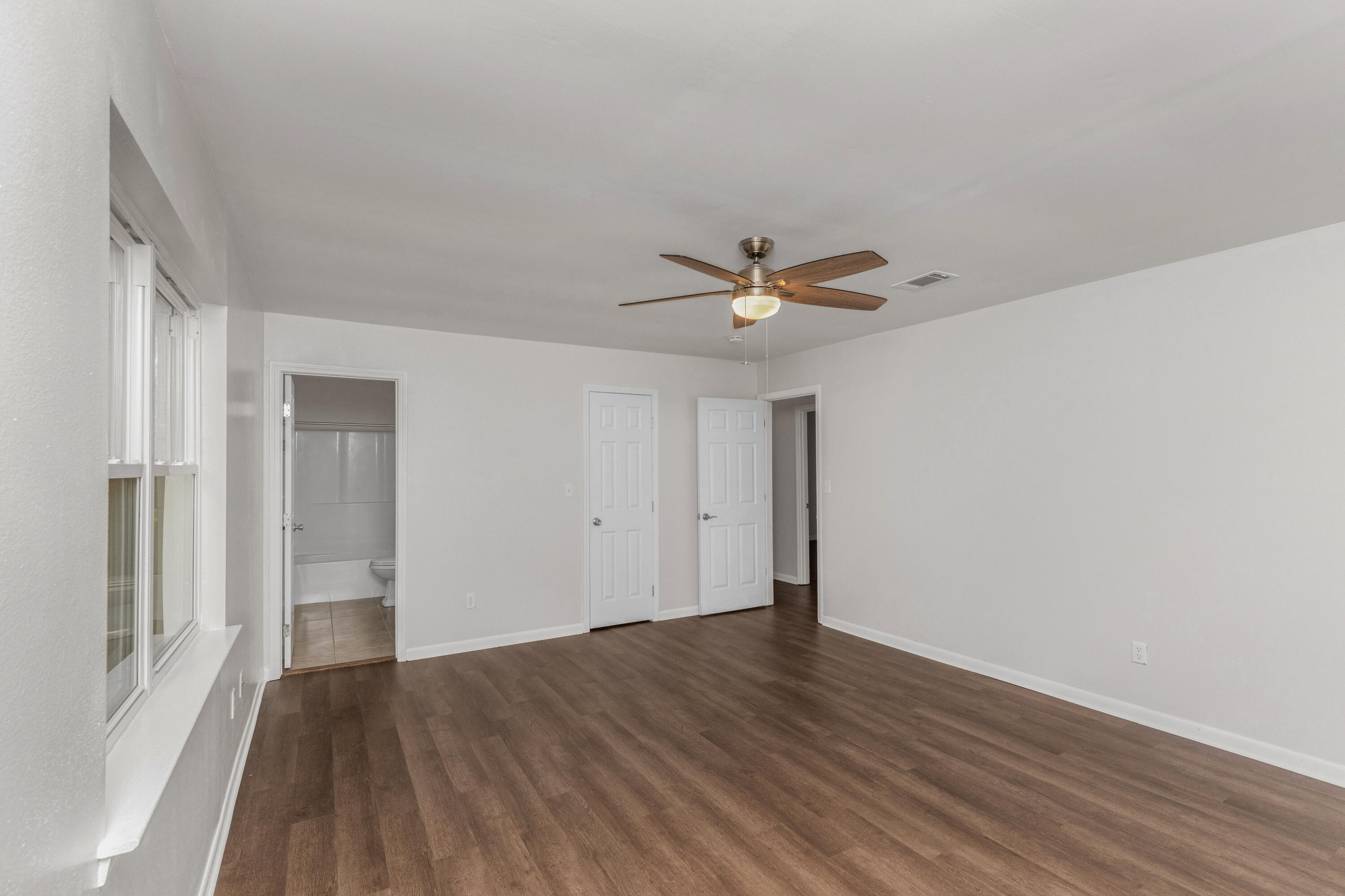 229 Madison Street Freeport, FL 32439 - Photo 30 of 44 a view of a livingroom with wooden floor and window