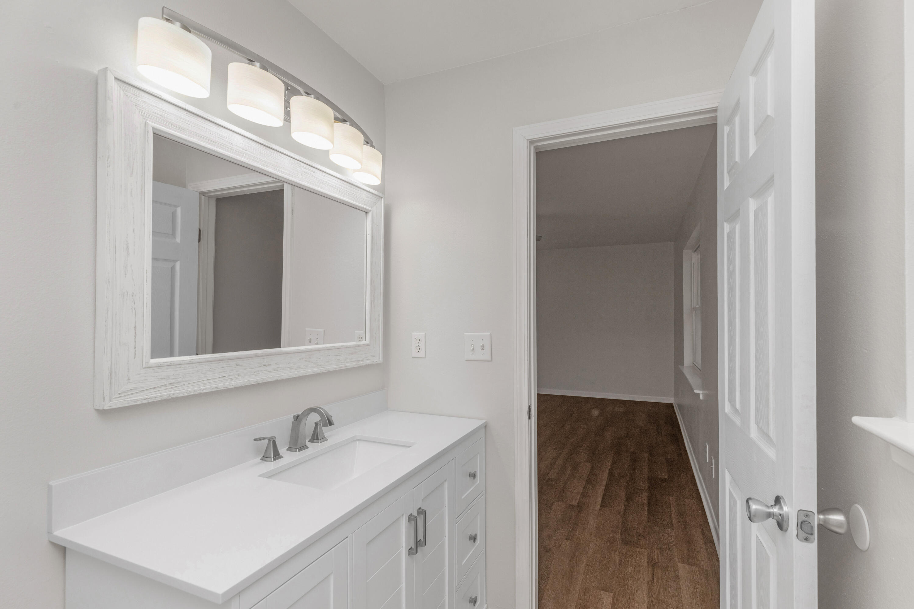 229 Madison Street Freeport, FL 32439 - Photo 32 of 44 a bathroom with a sink and a mirror