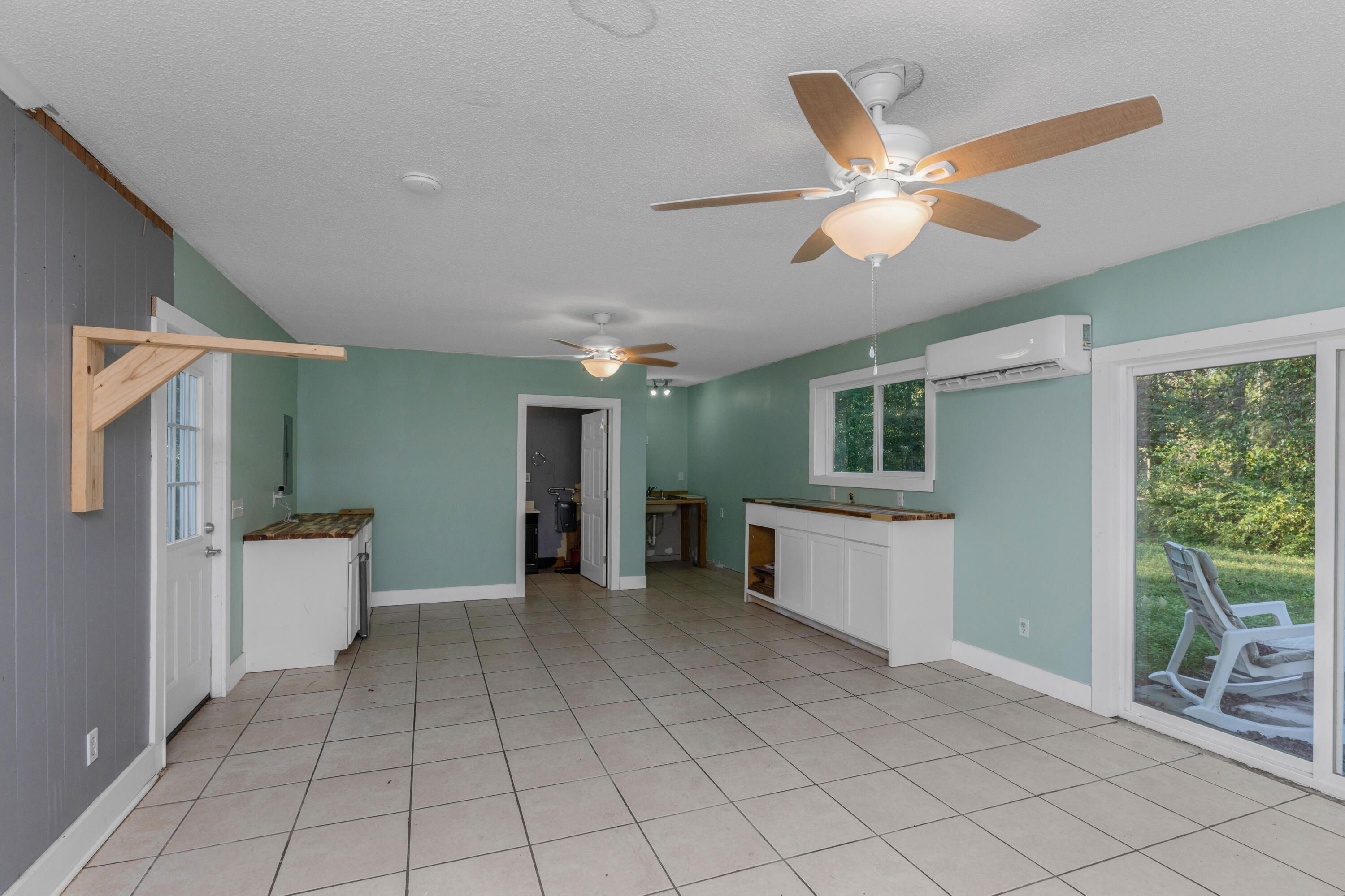 229 Madison Street Freeport, FL 32439 - Photo 37 of 44 a view of an empty room with window and cabinet