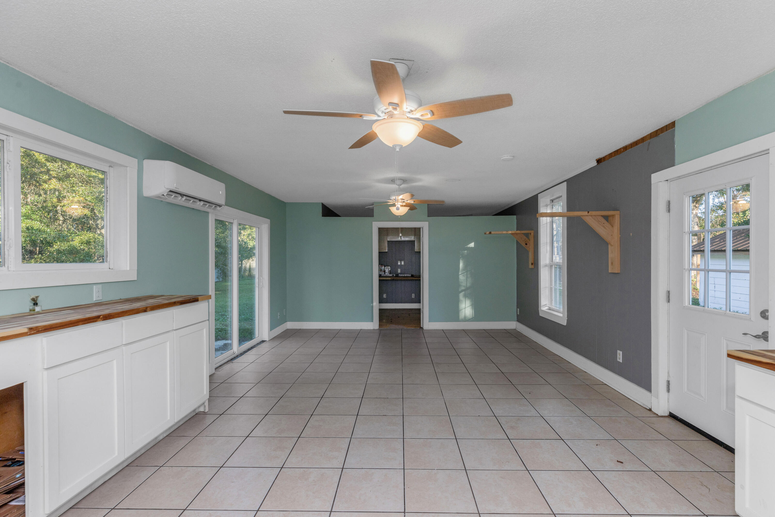 229 Madison Street Freeport, FL 32439 - Photo 38 of 44 a view of an empty room with window and cabinet