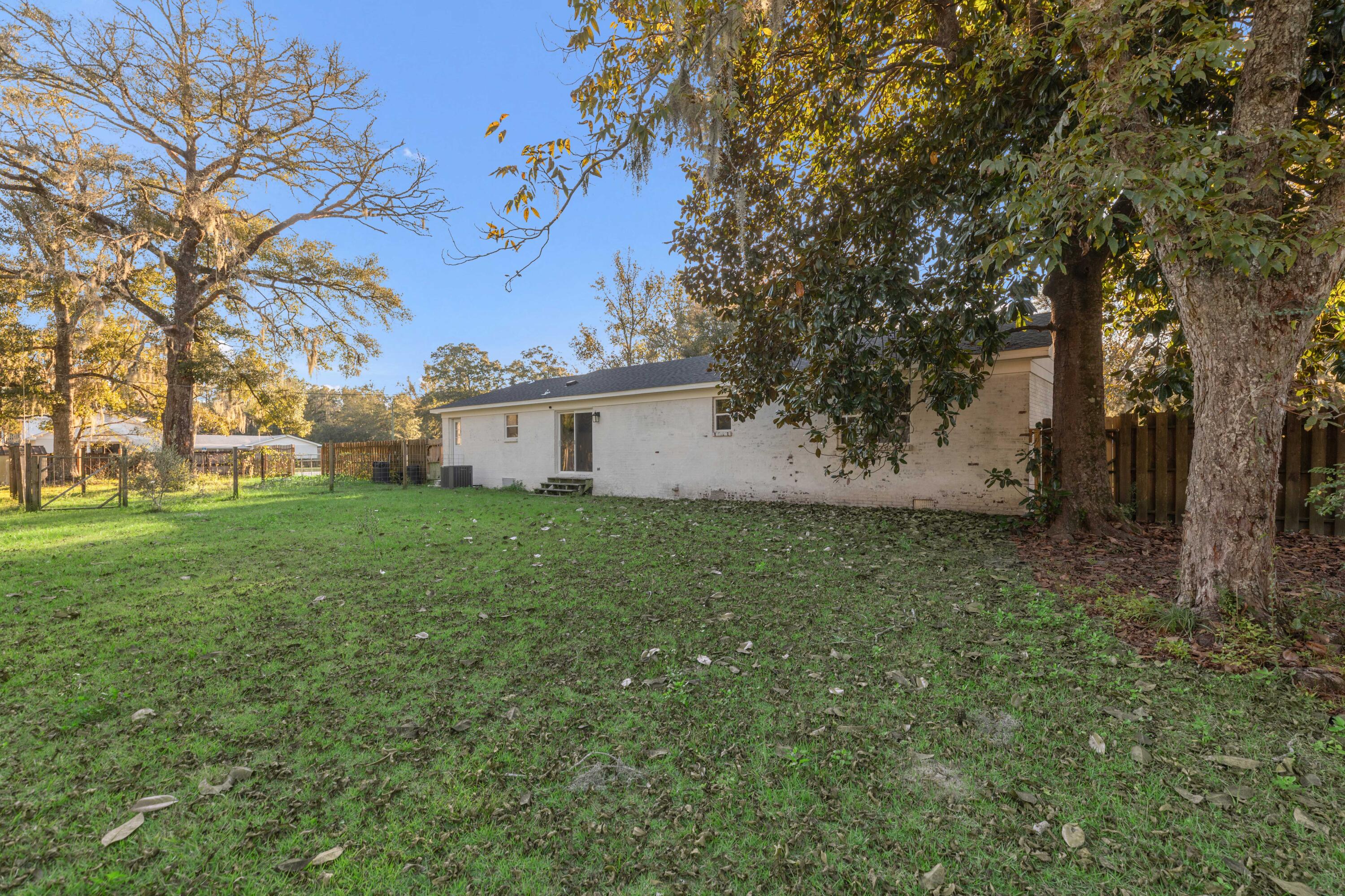 229 Madison Street Freeport, FL 32439 - Photo 41 of 44 a view of a house with a backyard