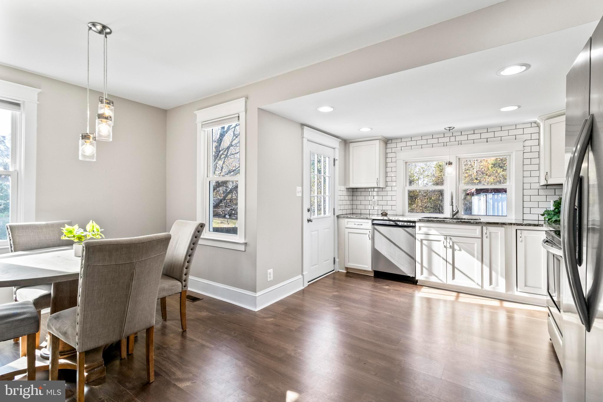 9005 Fairground Road Bel Alton, MD 20611 - Photo 12 of 54 a view of a dining room with furniture and wooden floor
