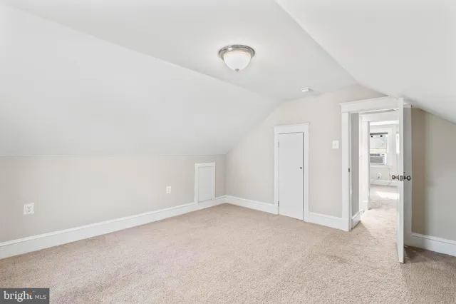 a view of an entryway with wooden floor and windows