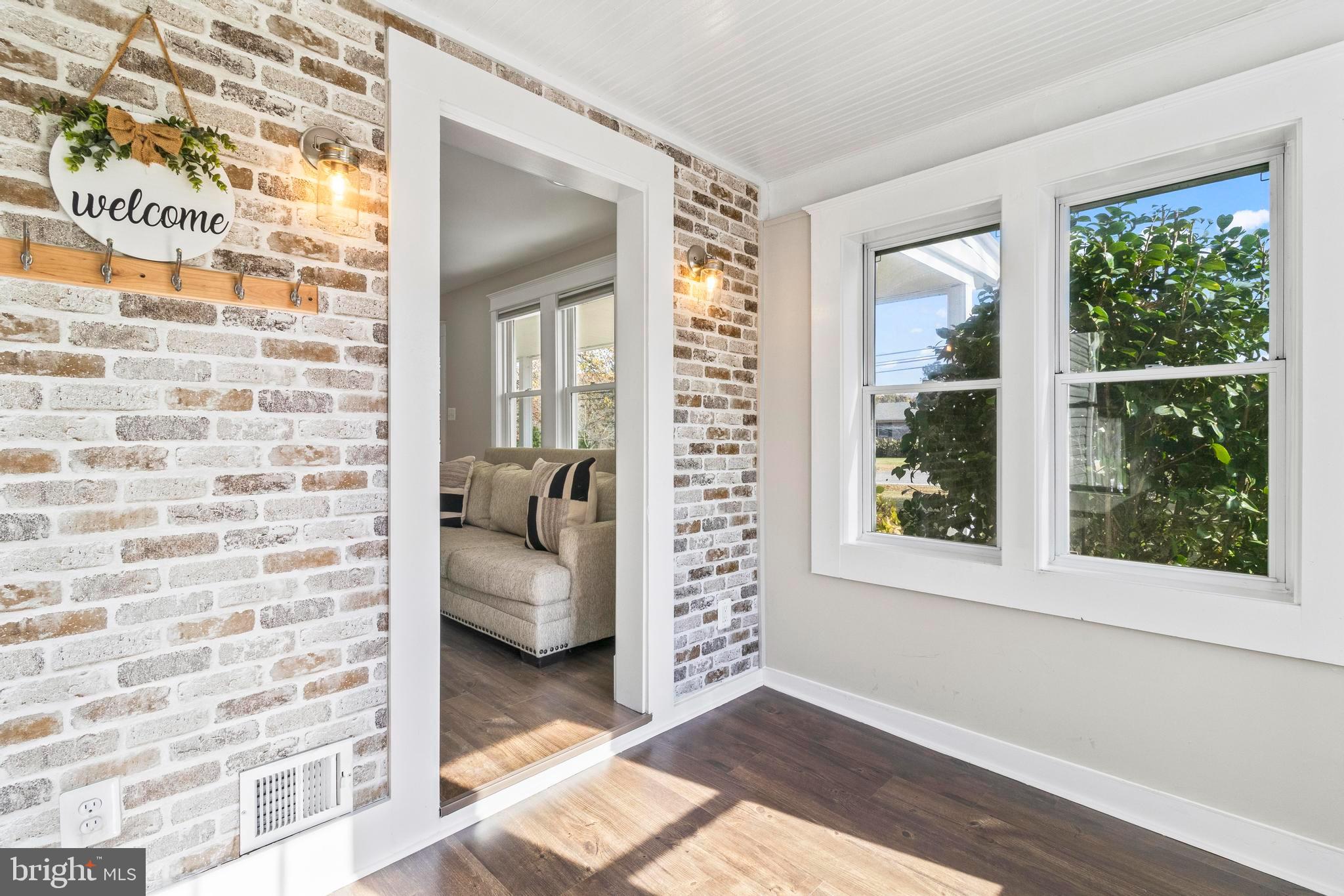 9005 Fairground Road Bel Alton, MD 20611 - Photo 19 of 54 a view of an entryway with wooden floor and windows