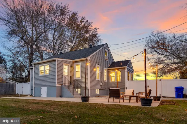 a front view of house with yard and outdoor seating
