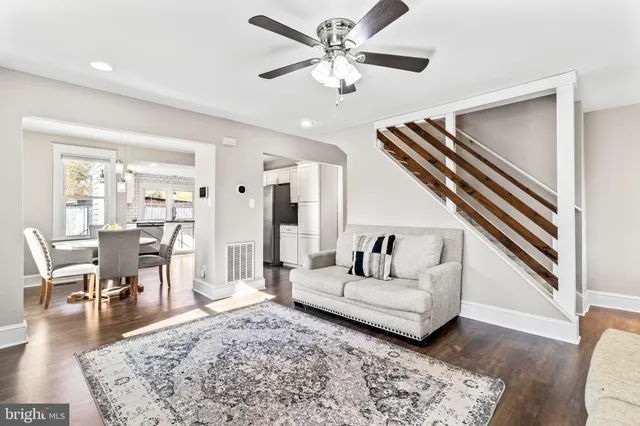 a bathroom with a sink a toilet a tub and a mirror