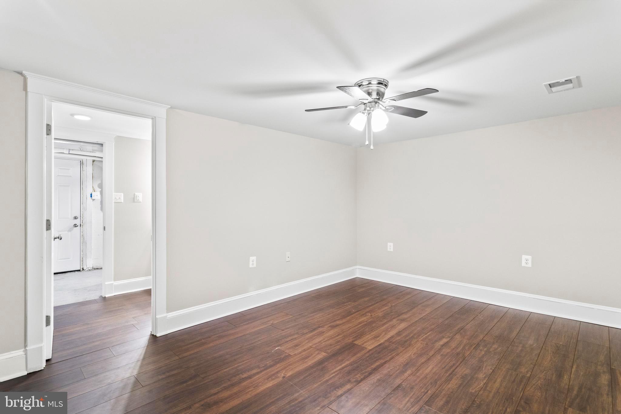 9005 Fairground Road Bel Alton, MD 20611 - Photo 24 of 54 a view of an empty room with wooden floor