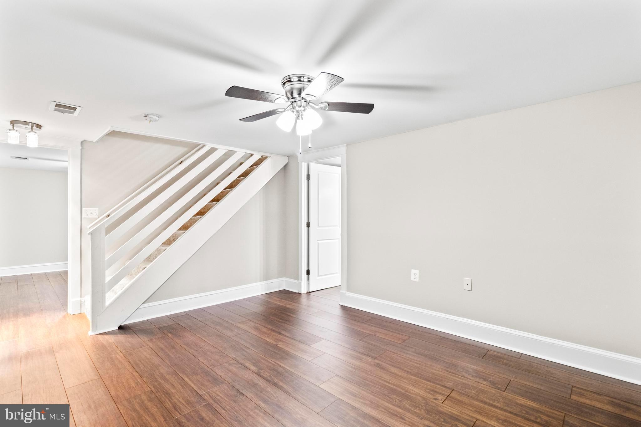 9005 Fairground Road Bel Alton, MD 20611 - Photo 25 of 54 wooden floor in an empty room with a window