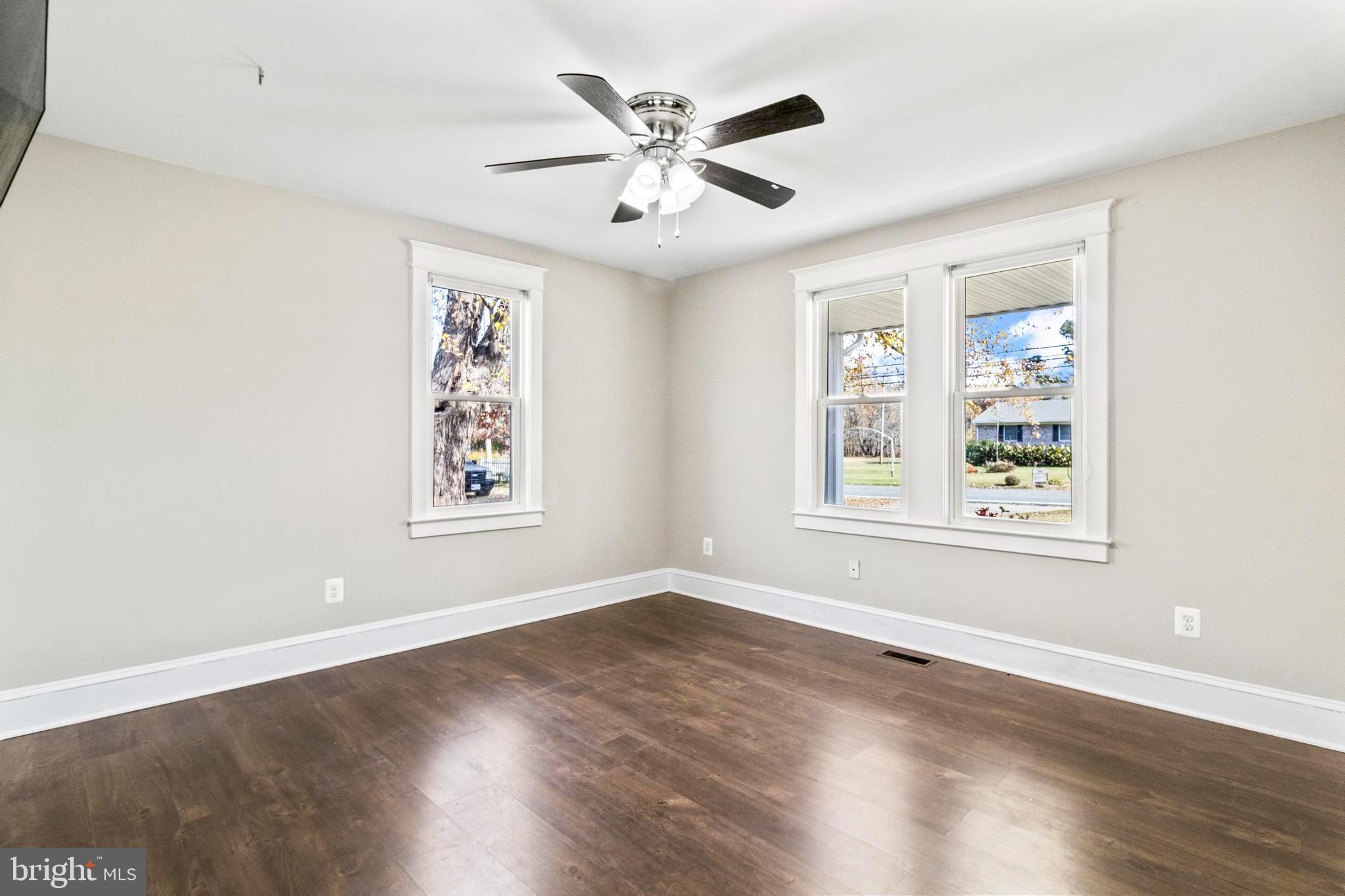 9005 Fairground Road Bel Alton, MD 20611 - Photo 27 of 54 a view of an empty room with wooden floor and a window