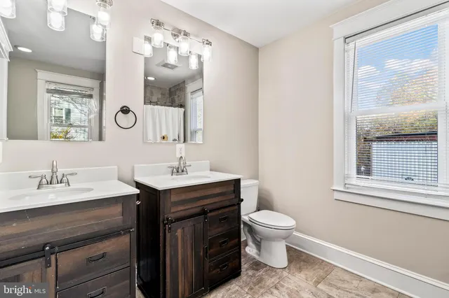 a view of front door with wooden floor and a window