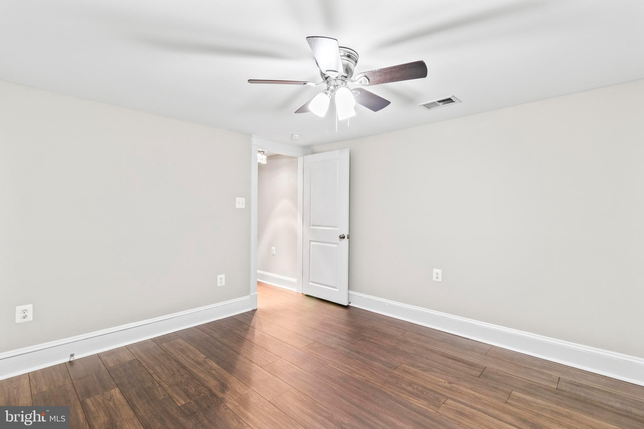 9005 Fairground Road Bel Alton, MD 20611 - Photo 32 of 54 wooden floor in an empty room