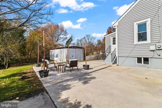 a view of a house with snow on the trees