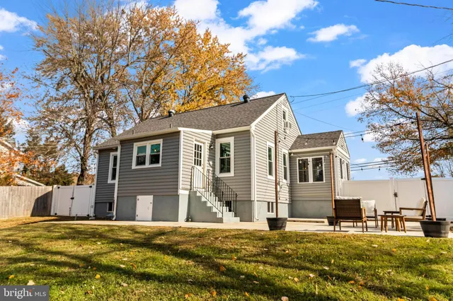 a view of a porch with furniture and floor to ceiling window