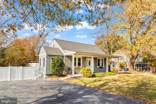 a view of a house with a tree tree front of house