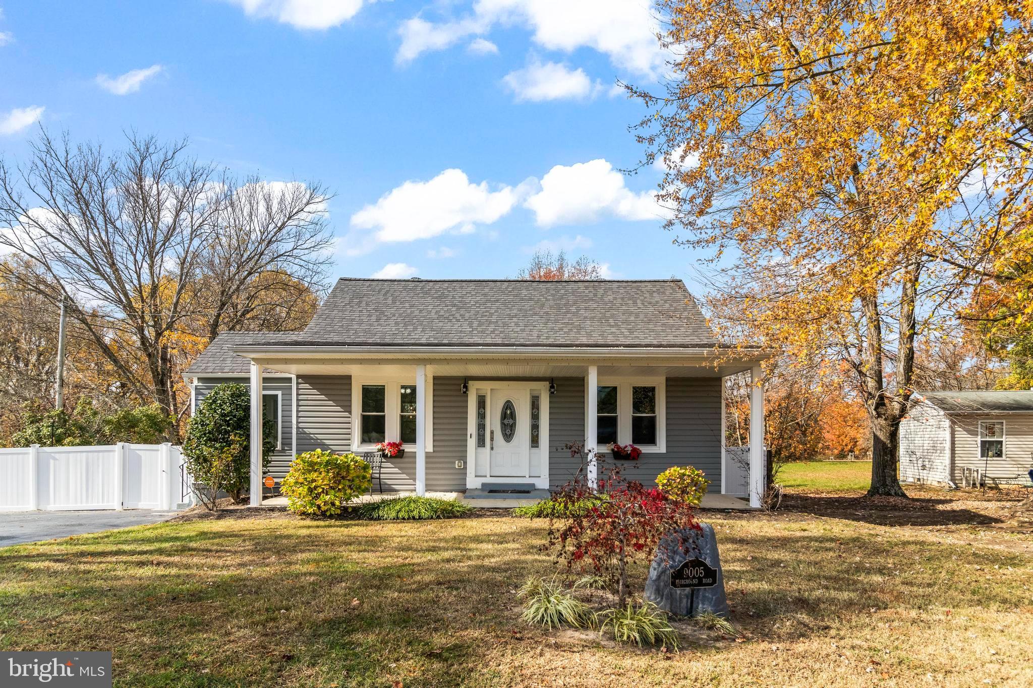 9005 Fairground Road Bel Alton, MD 20611 - Photo 44 of 54 a front view of a house with a garden and trees