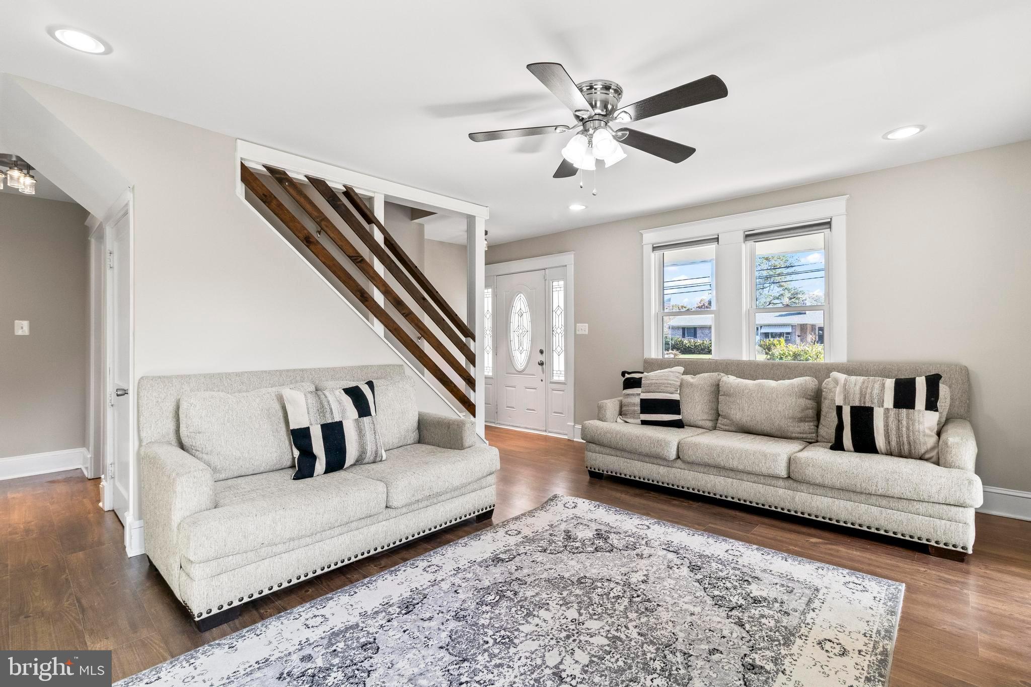 9005 Fairground Road Bel Alton, MD 20611 - Photo 5 of 54 a living room with furniture and a ceiling fan