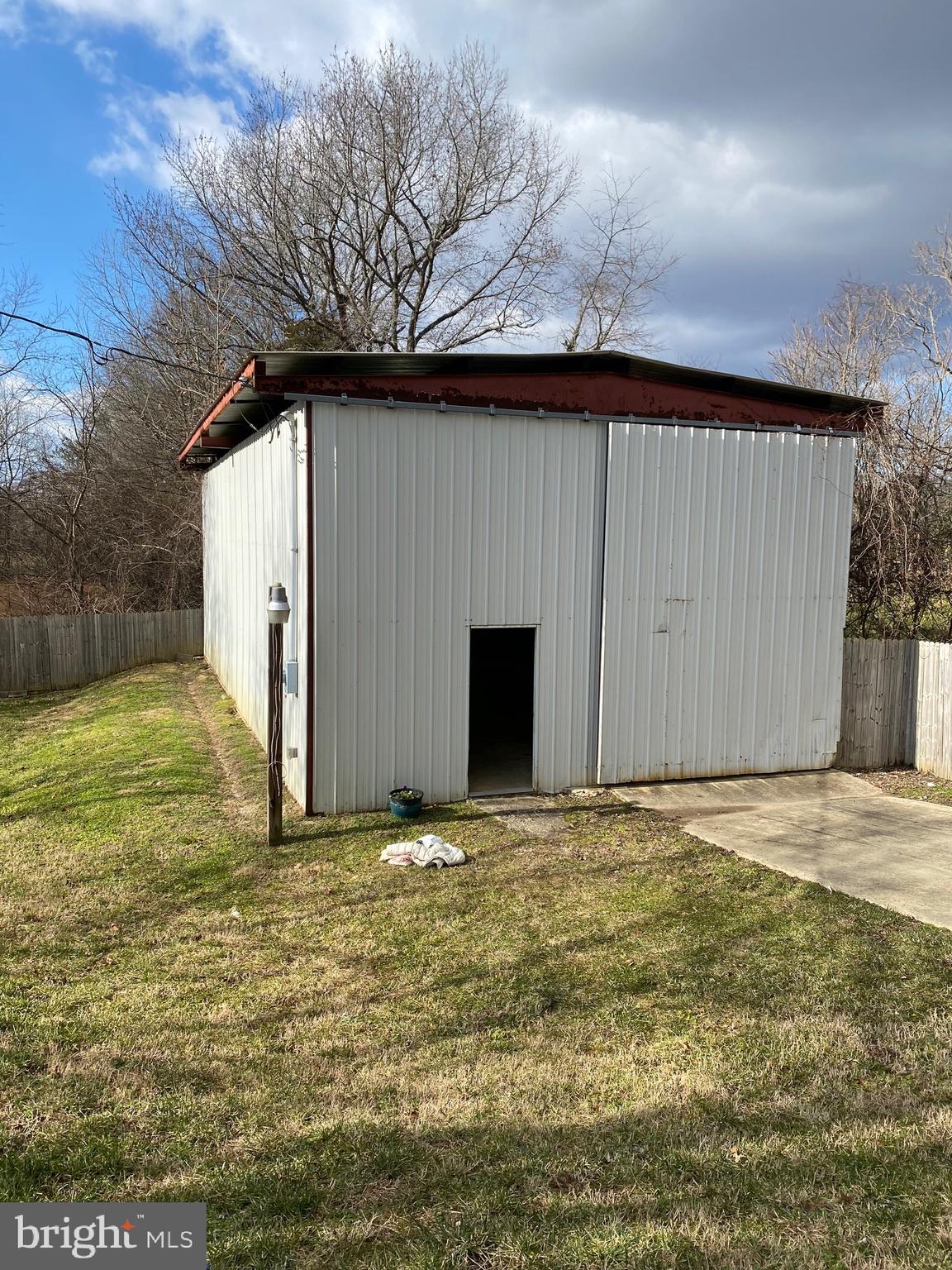 9005 Fairground Road Bel Alton, MD 20611 - Photo 51 of 54 a view of an empty room with yard and garage