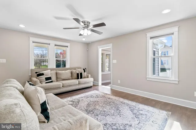 a living room with furniture and a rug