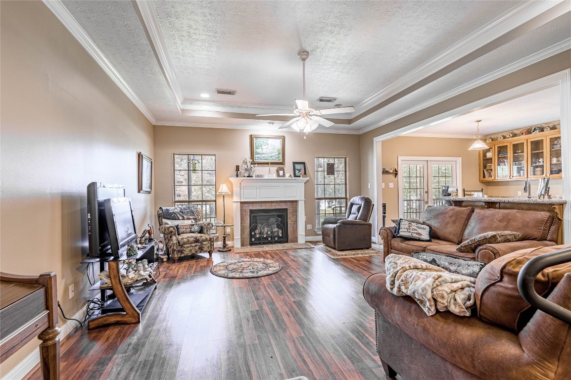 206 Lake Front Drive Trinity, TX 75862 - Photo 16 of 48 a living room with furniture fireplace and a chandelier