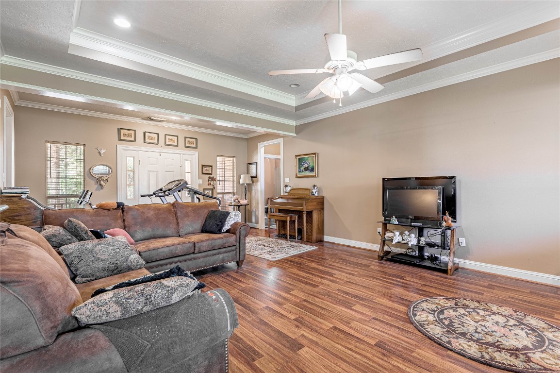 206 Lake Front Drive Trinity, TX 75862 - Photo 19 of 48 a living room with furniture and a chandelier