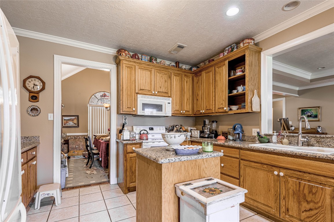 206 Lake Front Drive Trinity, TX 75862 - Photo 23 of 48 a kitchen with a refrigerator and a sink