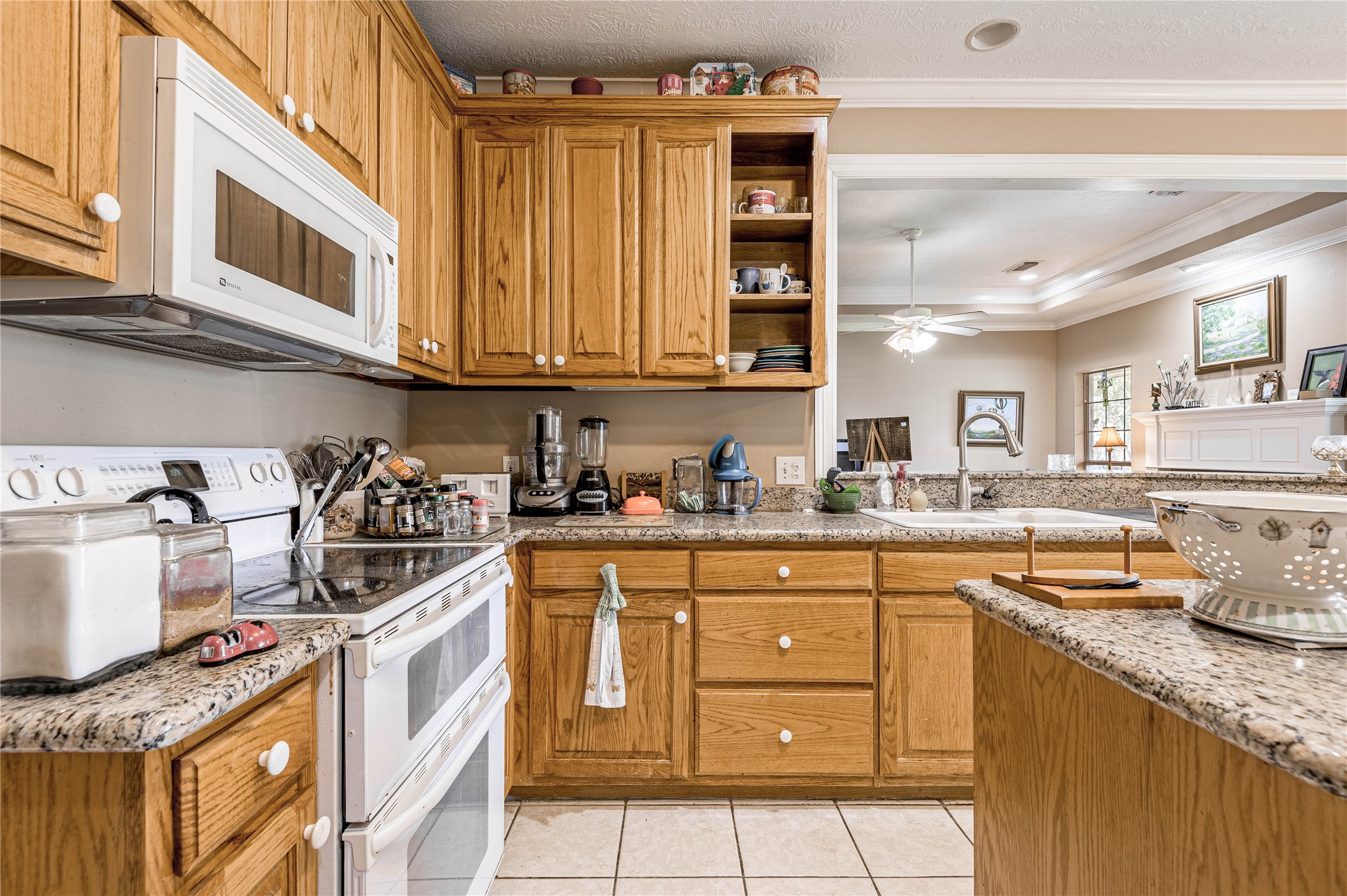 206 Lake Front Drive Trinity, TX 75862 - Photo 25 of 45 a kitchen with granite countertop a sink and cabinets