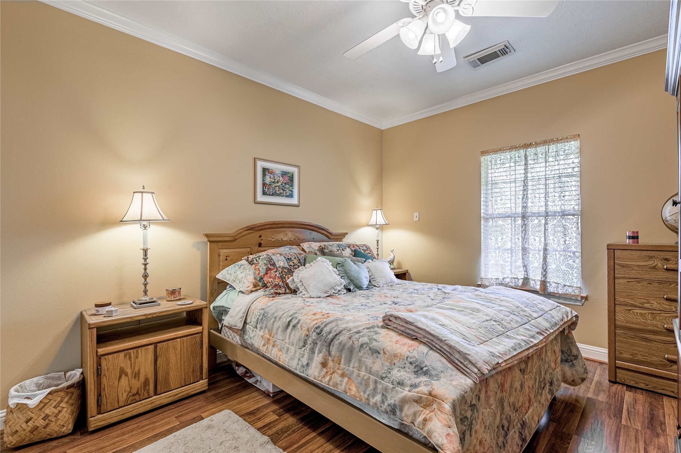 206 Lake Front Drive Trinity, TX 75862 - Photo 38 of 48 a bedroom with a bed and a chandelier