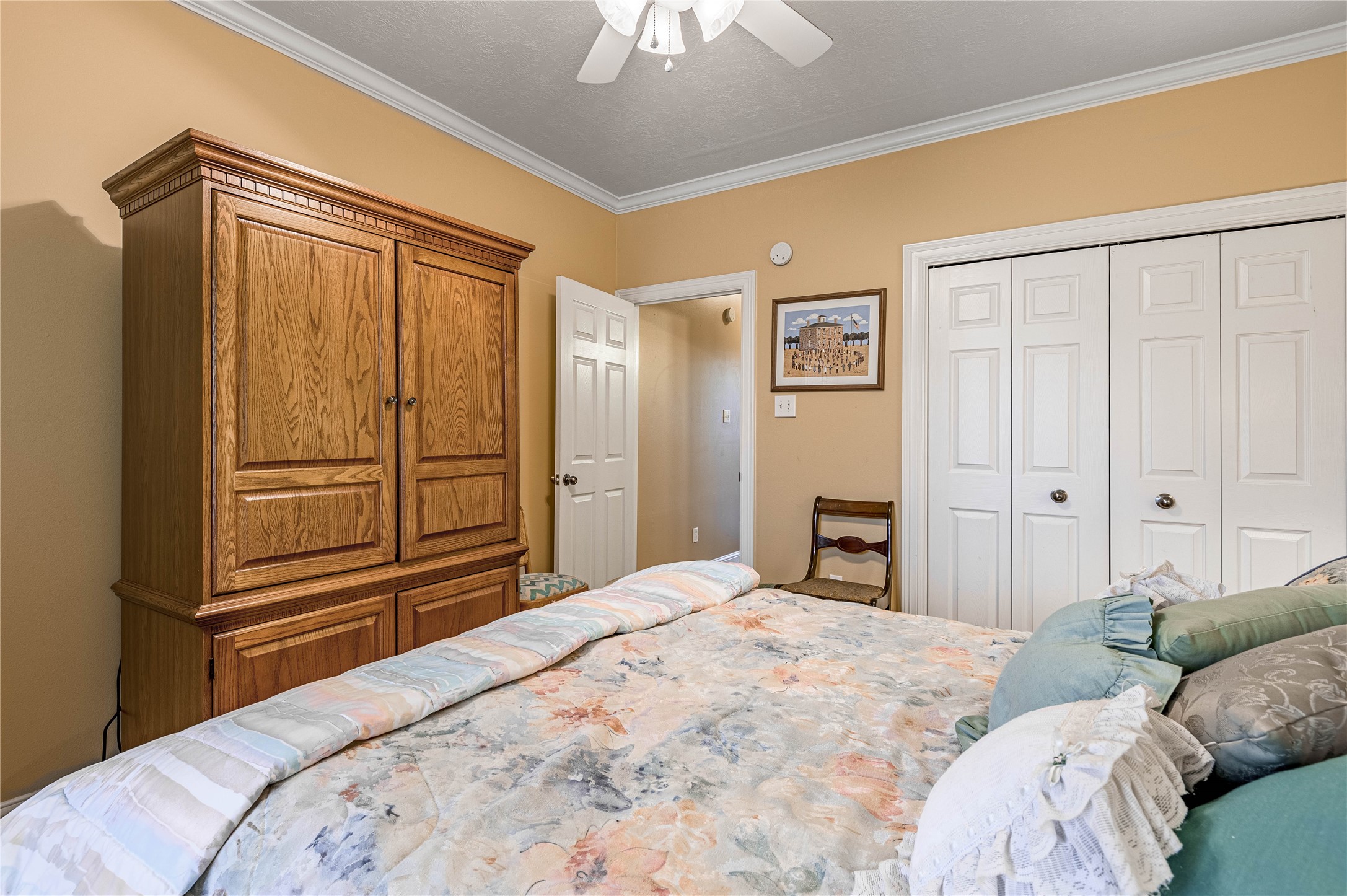 206 Lake Front Drive Trinity, TX 75862 - Photo 41 of 48 a bedroom with a bed and a chandelier