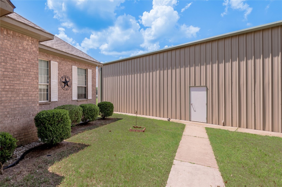 206 Lake Front Drive Trinity, TX 75862 - Photo 6 of 48 a backyard of a house with a garden