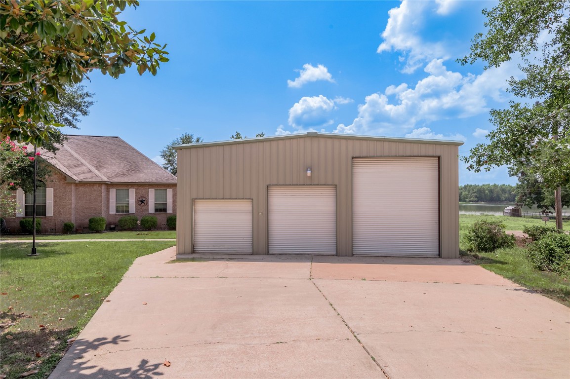 206 Lake Front Drive Trinity, TX 75862 - Photo 8 of 48 a front view of a house with a yard and garage