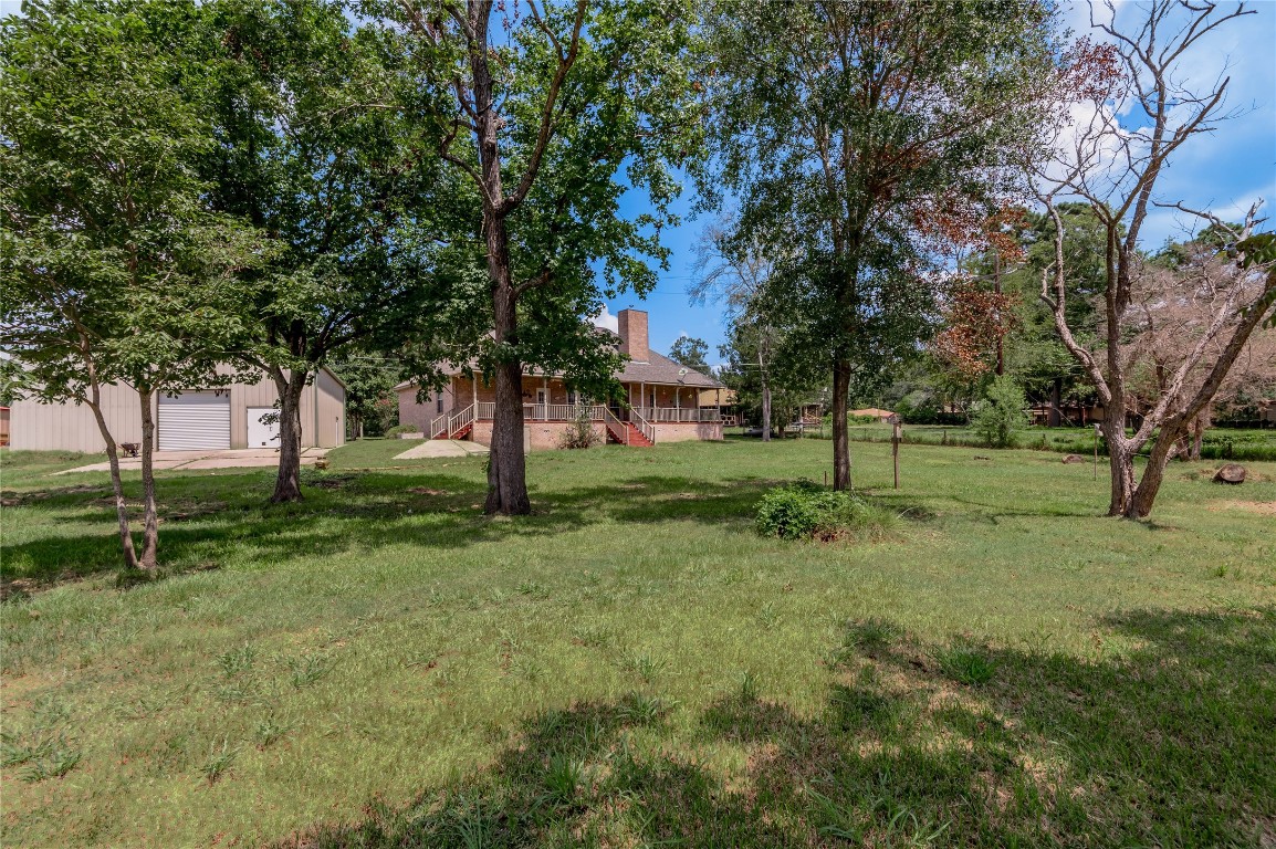 206 Lake Front Drive Trinity, TX 75862 - Photo 9 of 48 a view of white house with a big yard