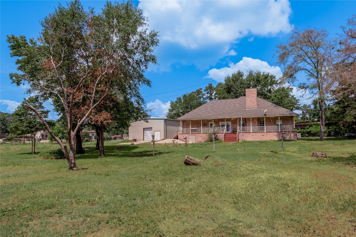 206 Lake Front Drive Trinity, TX 75862 - Photo 10 of 48 a view of a house with a yard