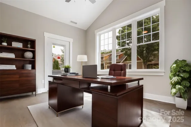 a view of a kitchen counter top space and windows