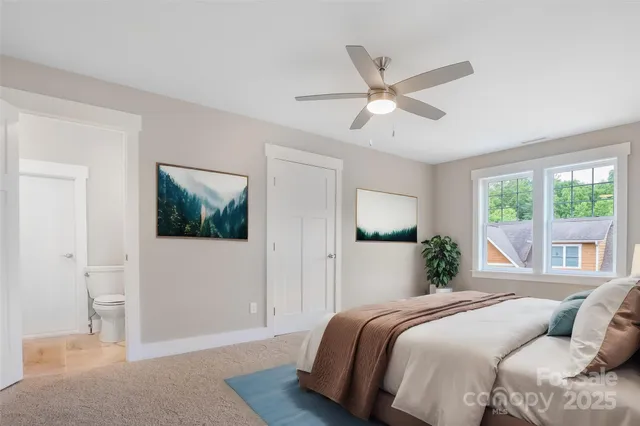 a bedroom with a large bed and a window