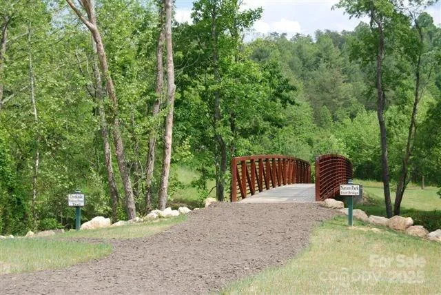 a view of backyard of a house with outdoor seating
