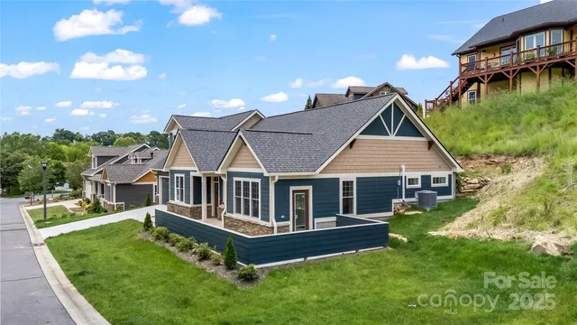 a view of a house with a yard and deck