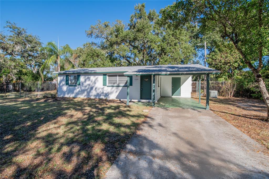 11210 Thomas Street Seffner, FL 33584 - Photo 1 of 1 a view of a house with a yard