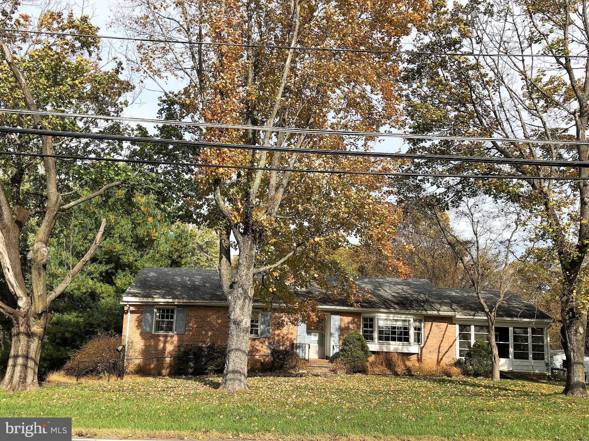 16031 Riffle Ford Road Gaithersburg, MD 20878 - Photo 1 of 23 front view of a house with a yard