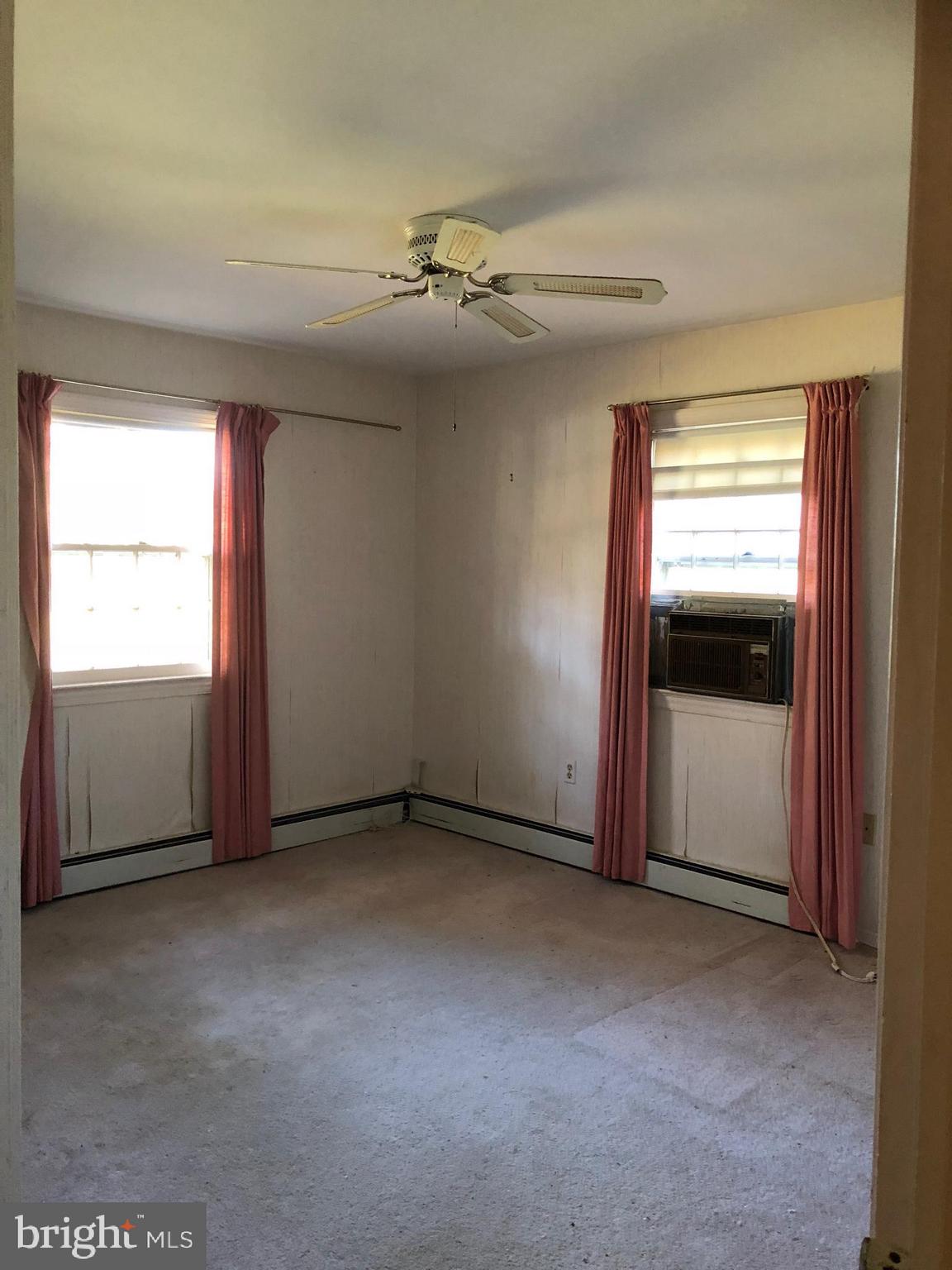 16031 Riffle Ford Road Gaithersburg, MD 20878 - Photo 10 of 23 an empty room with windows and closet