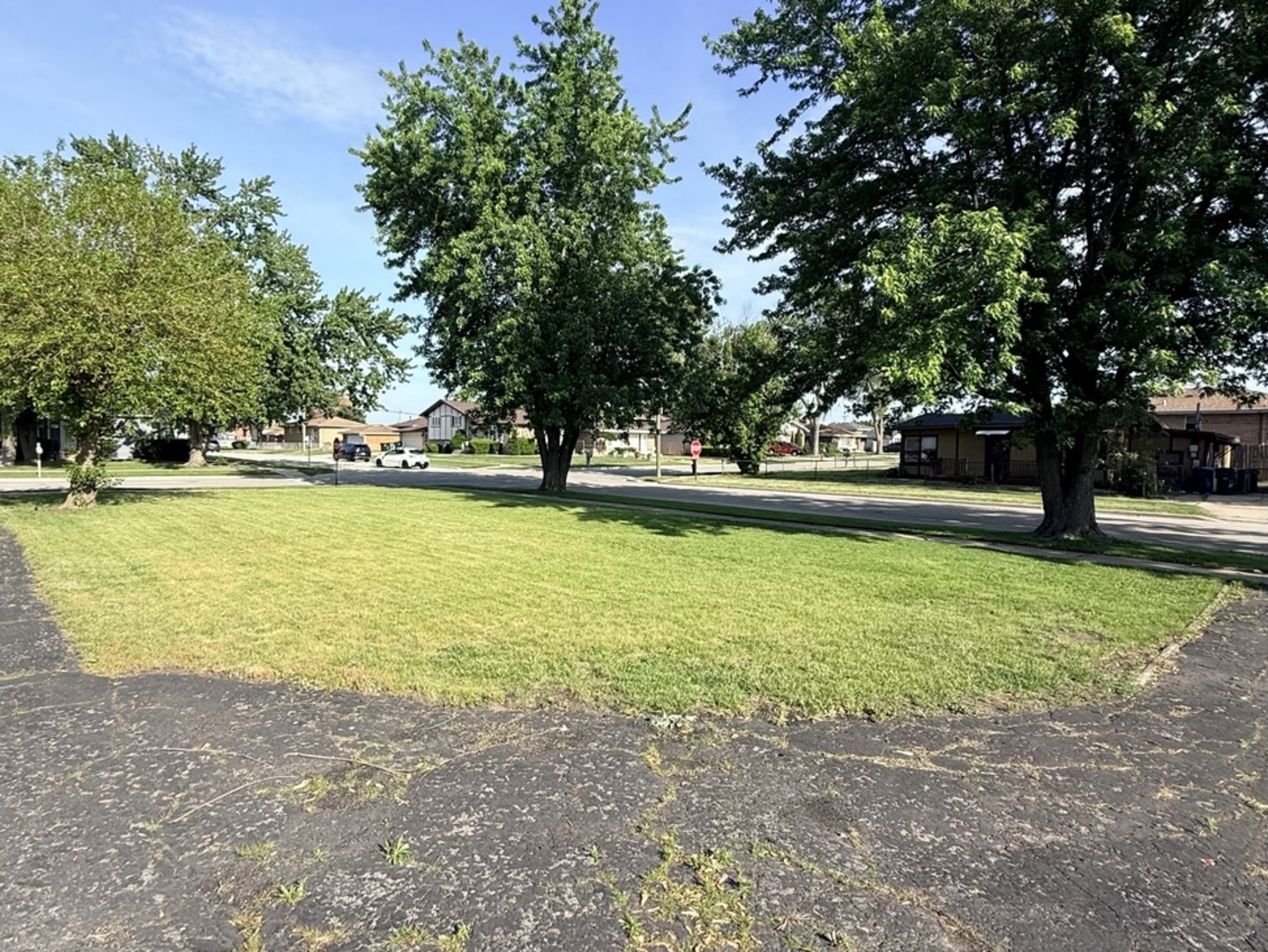 8356 South 78th Avenue Bridgeview, IL 60455 - Photo 32 of 39 a view of a swimming pool and trees in the background