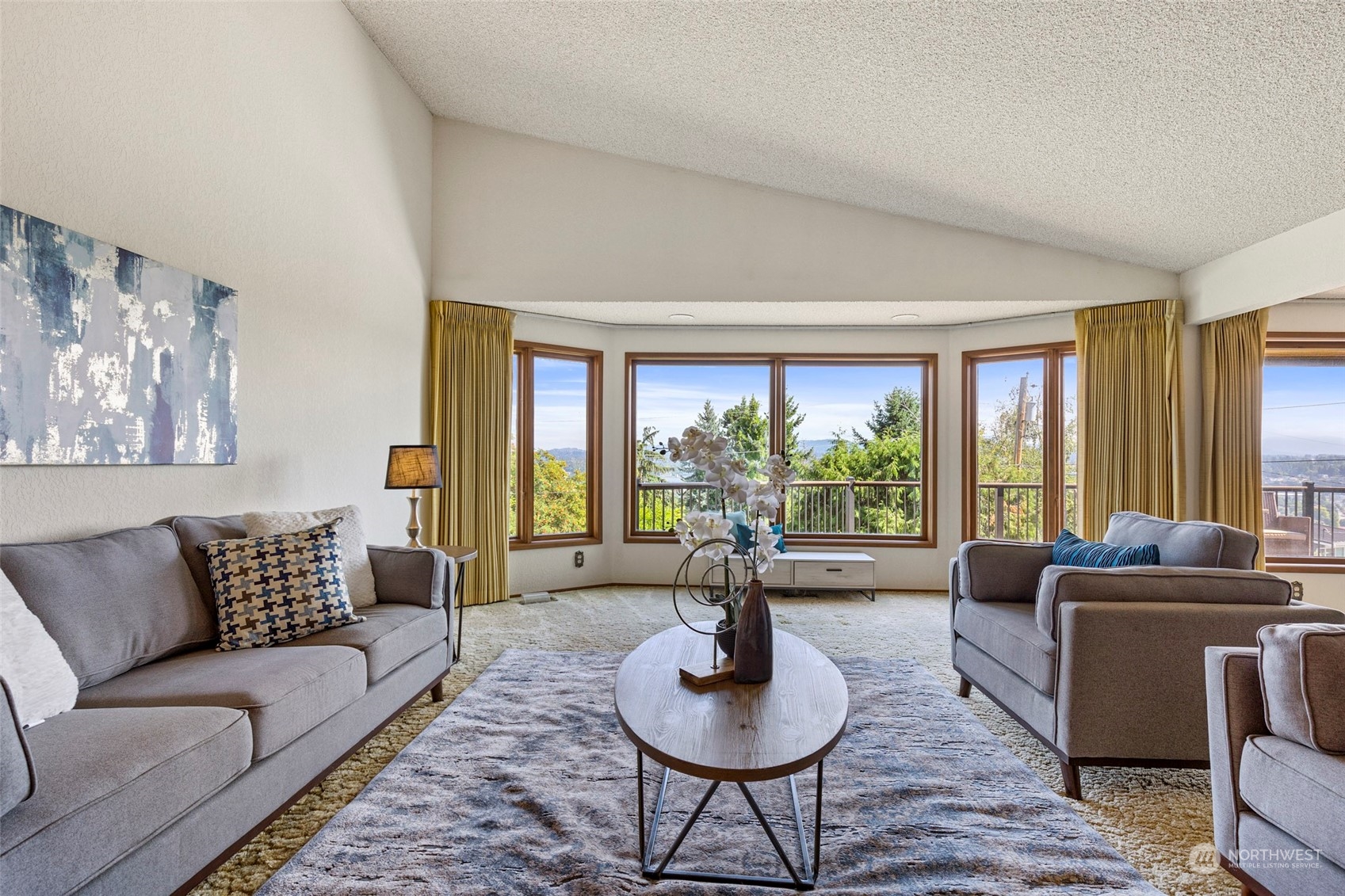 411 Seneca Court Northwest Renton, WA 98057 - Photo 11 of 37 a living room with furniture potted plant and a large window