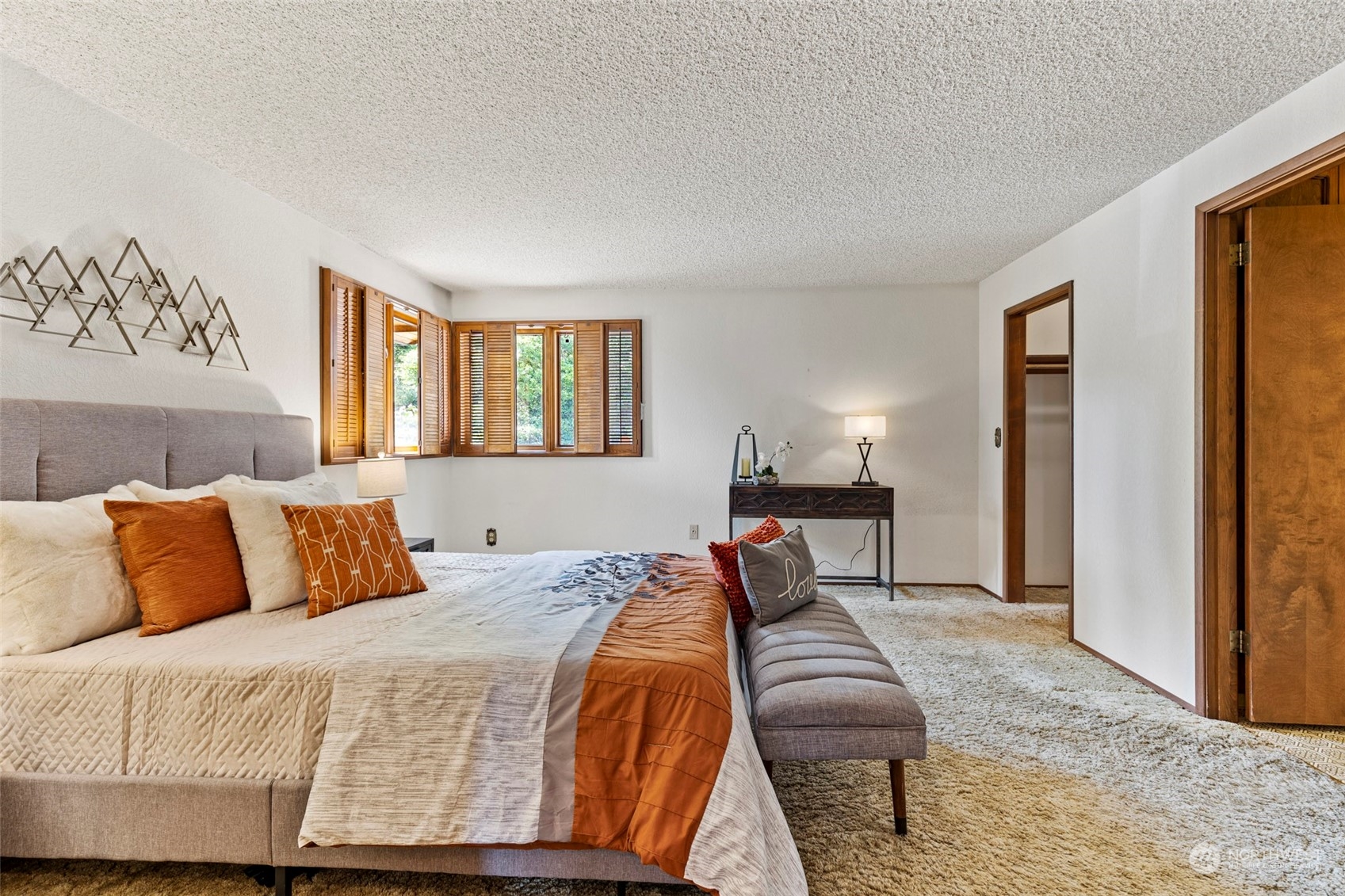 411 Seneca Court Northwest Renton, WA 98057 - Photo 14 of 37 a bedroom with a large bed and a window