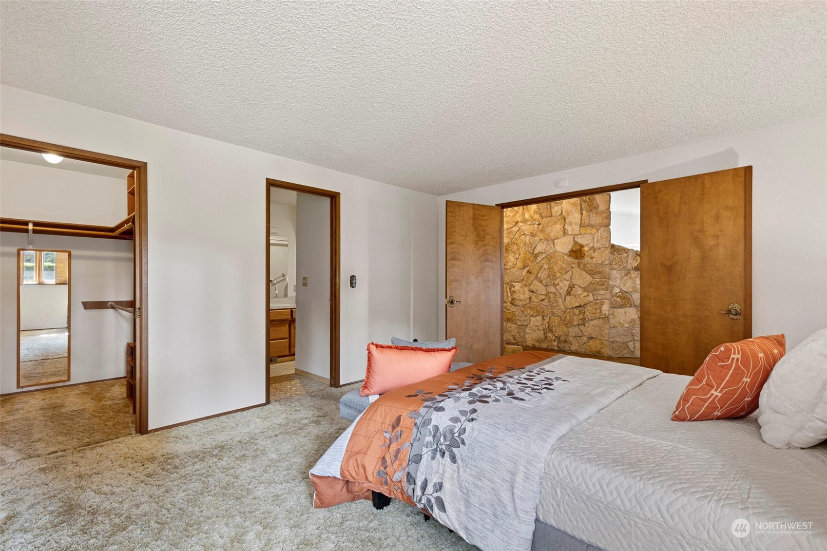 411 Seneca Court Northwest Renton, WA 98057 - Photo 17 of 37 a bedroom with a bed and wooden floor