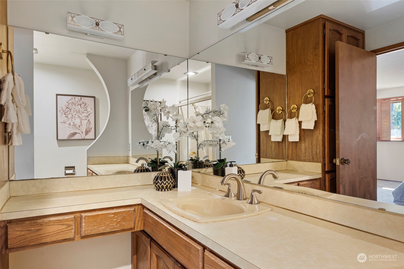 411 Seneca Court Northwest Renton, WA 98057 - Photo 20 of 37 a bathroom with a sink double vanity and mirror