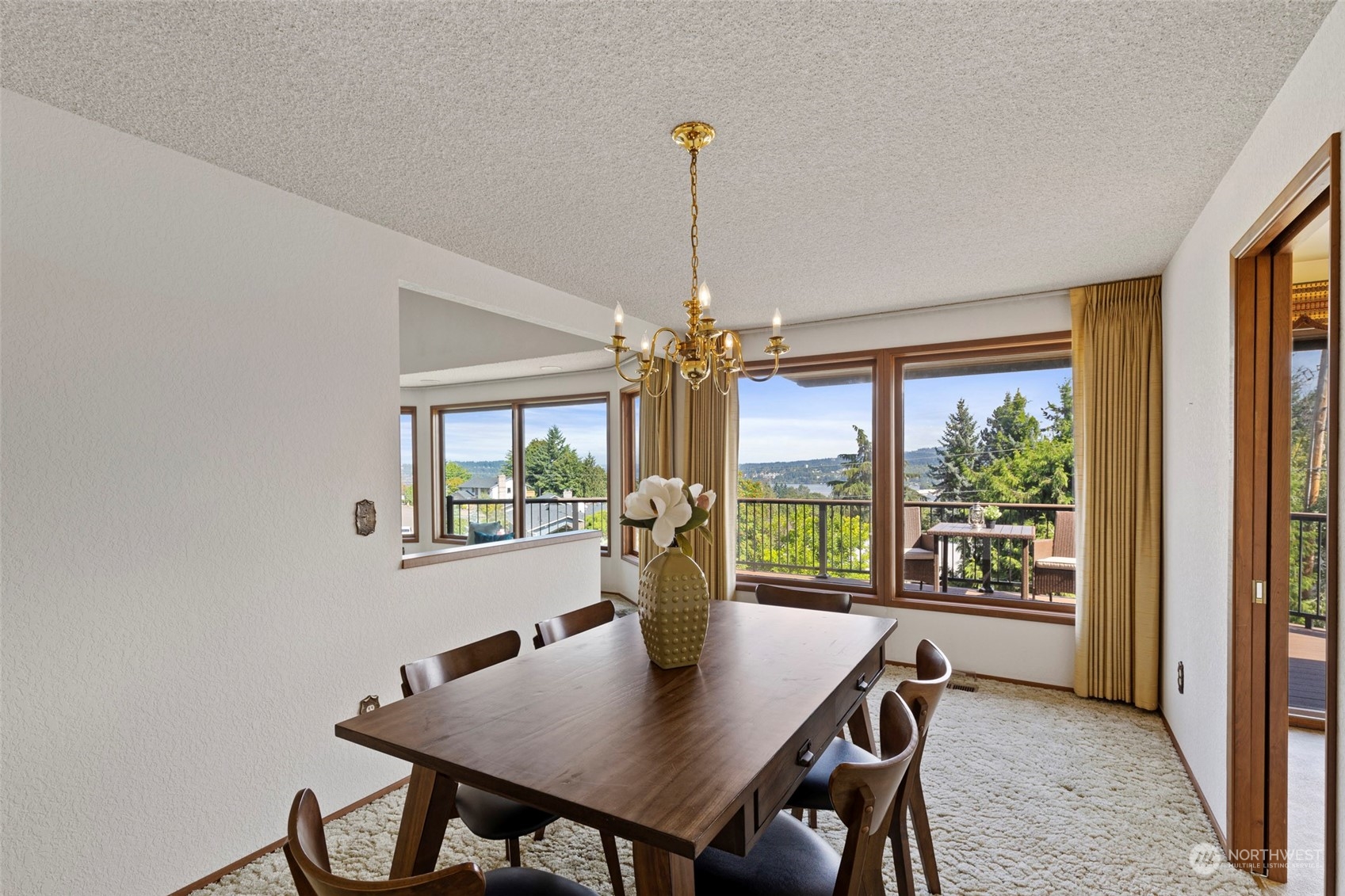 411 Seneca Court Northwest Renton, WA 98057 - Photo 21 of 37 a view of a dining room with furniture window and outside view
